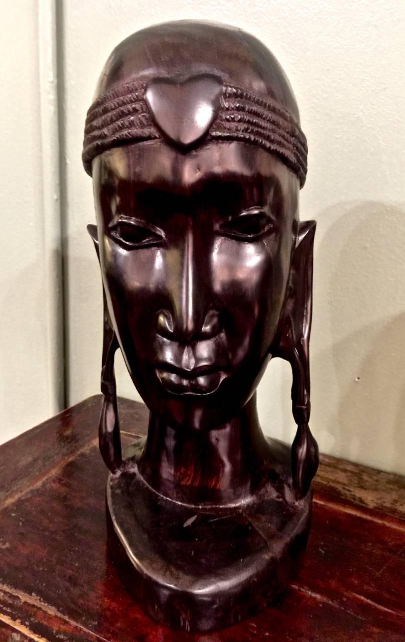 Beautifully detailed African carved male bust in solid ebony. The figure has been expertly modeled by a master craftsman. The figures is expressive and nearly photographic. Ebony is very dense and difficult to carve wood; the craftsman has chosen to