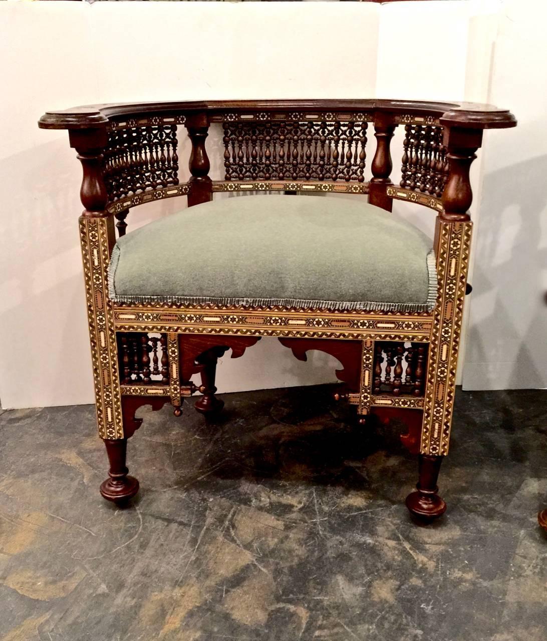 This is an unusual pair of stunning antique Damascus or Syrian finely inlaid barrel back chairs. The chairs are in remarkably good condition having old very minor restorations; they are newly upholstered in a fine minty-sage mohair velvet and