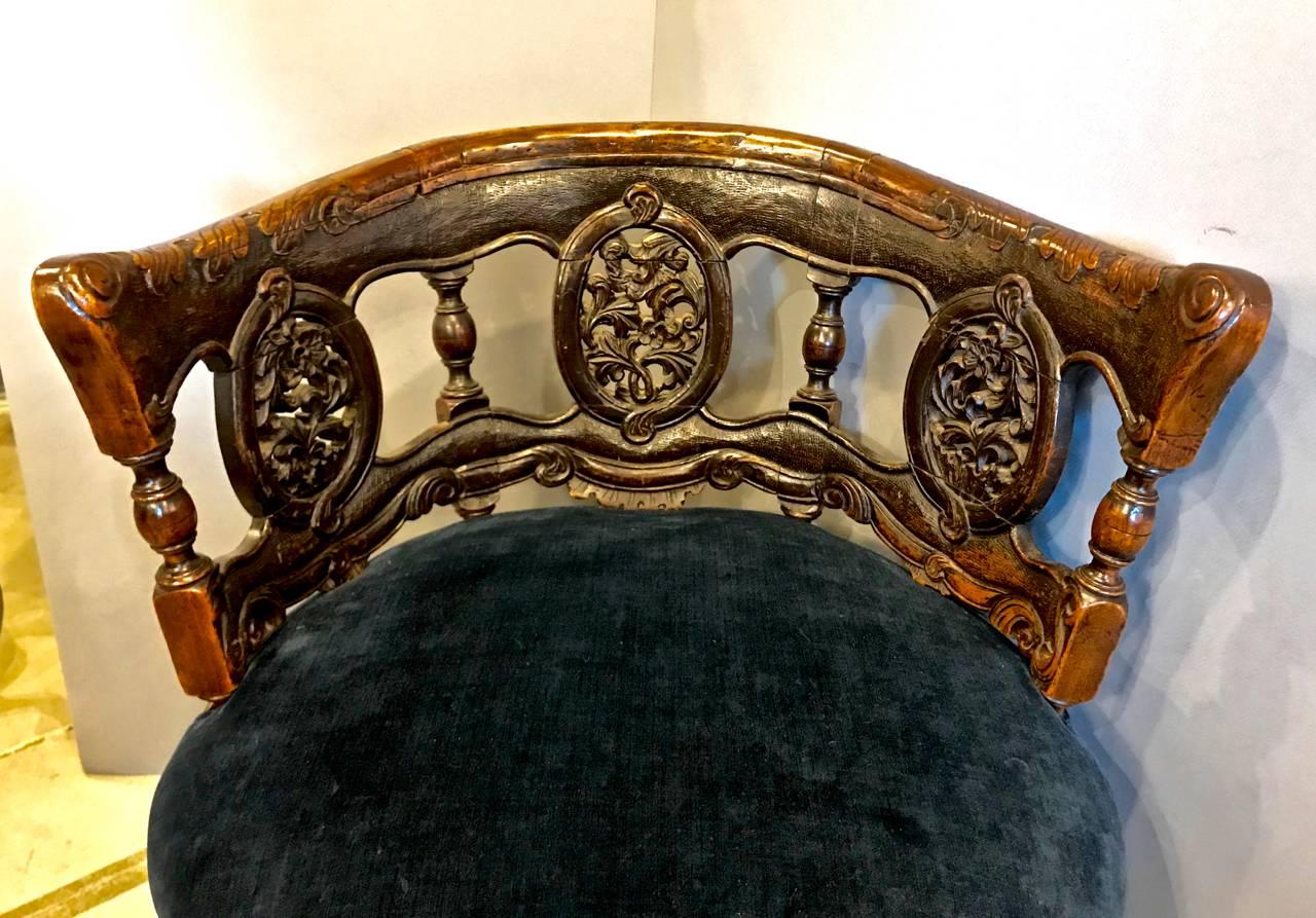 This is an unusual form of barrel back chair featuring six beautifully carved footed cabriole legs. I believe that the chair is mid-to late 19th c. Anglo- Indian. The chair is finely detailed with carved oak and acanthus leaves. The chairs has been