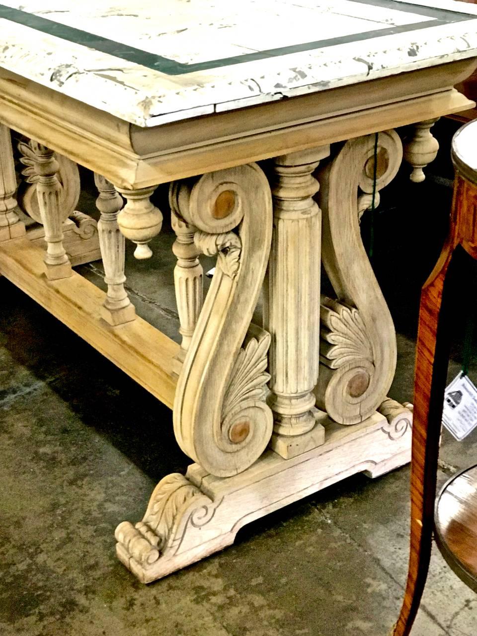 This is a classic 19th century beautifully carved Italian Renaissance Revival library or console table that has been stripped to its raw wood and having acquired a good natural patina.