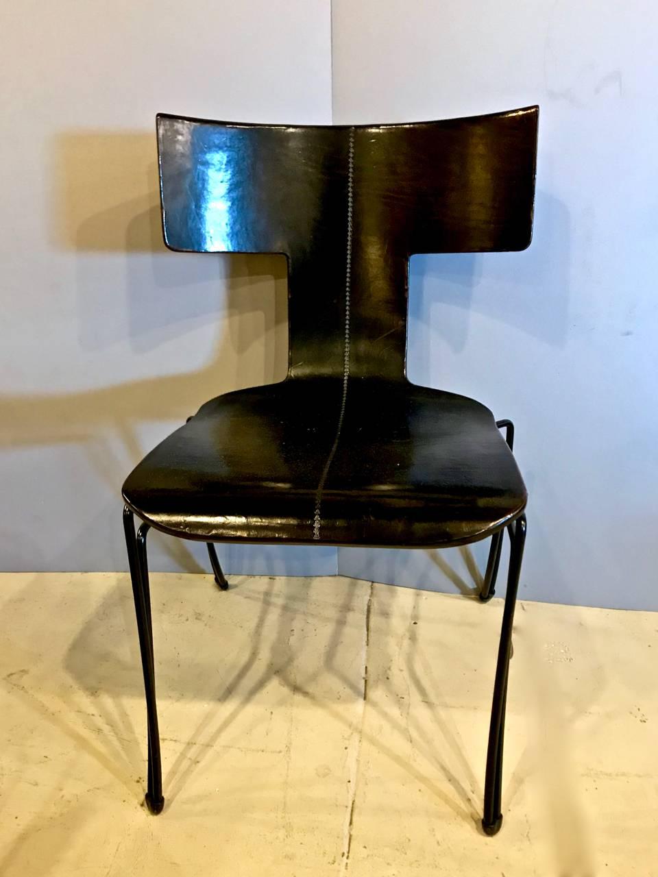 Wonderful set of six John Hutton for Donghia Anziano klismos form chairs. This set of Anziano chairs features the highest quality option of leather-clad bentwood seats. All chairs are in very good condition.