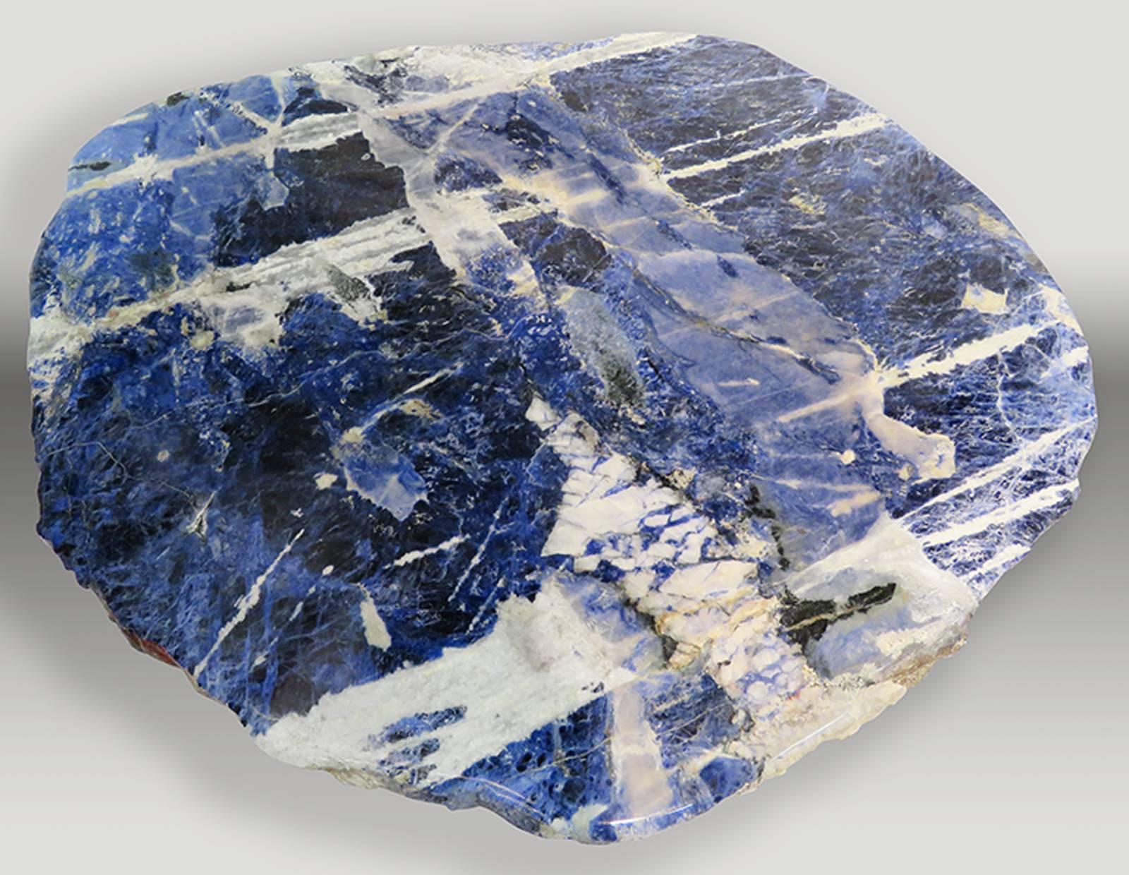 Sodalite slabs from Brazil.
Pair of sodalite center tables, each table has its own base so it can be adjusted to the space needed.
Sodalite o means “sodium stone”, because its chemical composition presents great amounts of sodium.
Sodalite is a
