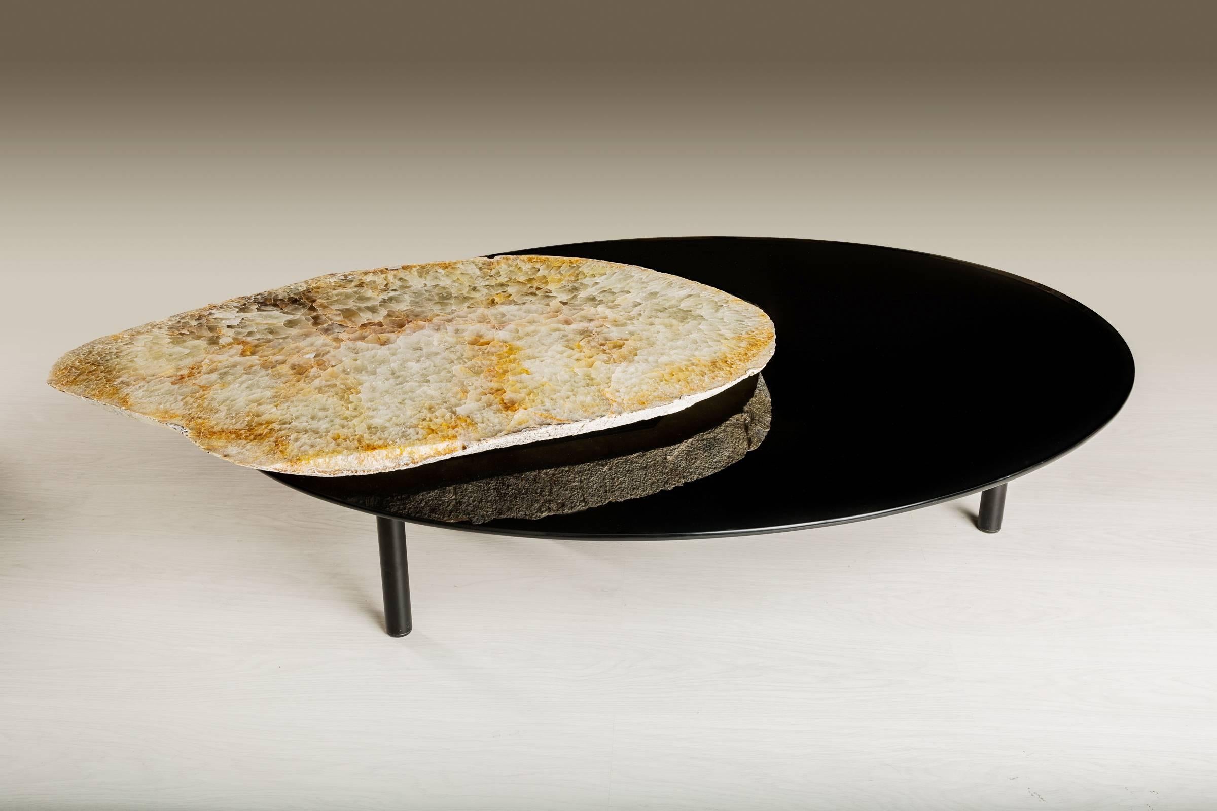 This center table is made from an agate slab from Brazil, it has a combination of colors between white, beige and brownish circumference.
Agates are formed in rounded nodules, which are sliced open to bring out the internal pattern hidden in the