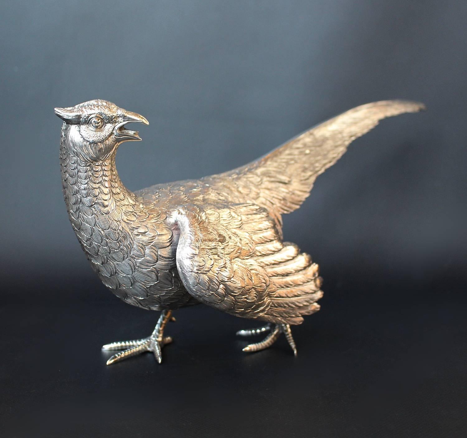 A pair of Mid-Century, Continental sterling silver pheasants. A cock and a hen with fine detail. Stamped Sterling 925, Germany to feet, with British import marks for London 1950-1951.

Measures: Cock H 17cm, L 26cm, W 11cm

Hen H 18cm, L 37cm, D