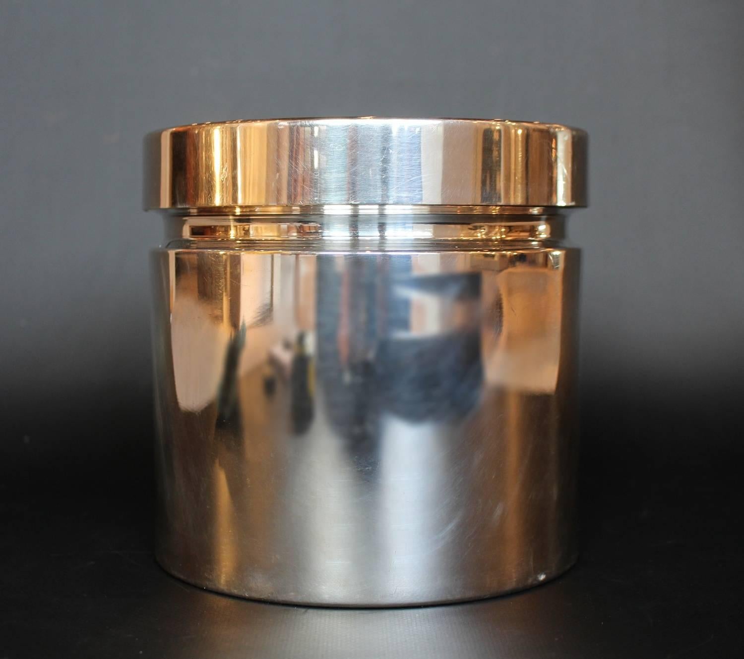 A silver plated ice bucket with lid designed by Gio Ponti for Sabattini of Italy. Copper and glass lined interior. Stamped Sabattini, Made in Italy to underside.

 