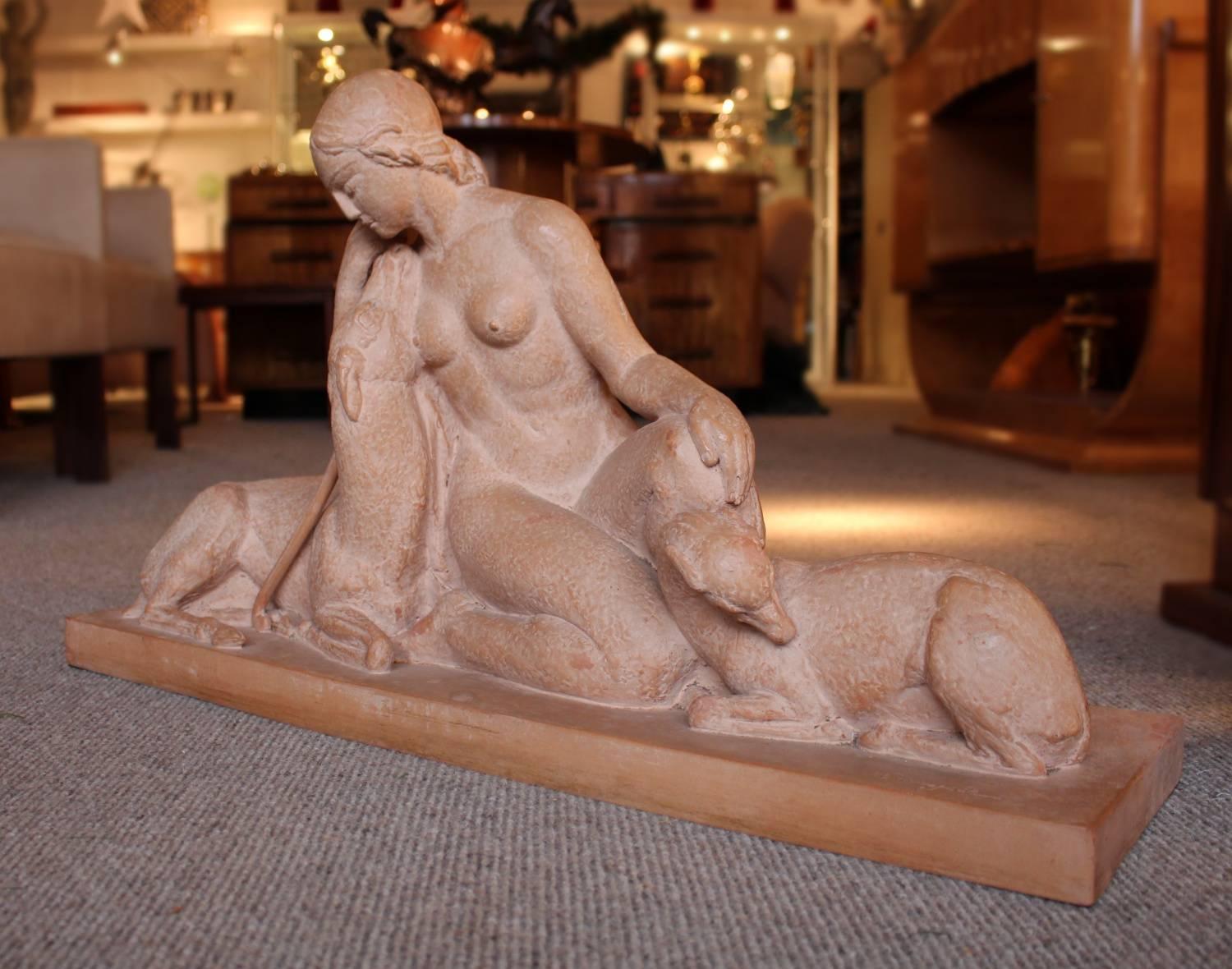 'Artemis', an Art Deco terracotta sculpture group by André Laveysse (1906-1991). A rural group of Artemis kneeling with two fawns, set on an integral base. Signed Laveysse to base. Stamped for Susses Frères foundry.
Artemis was the goddess of