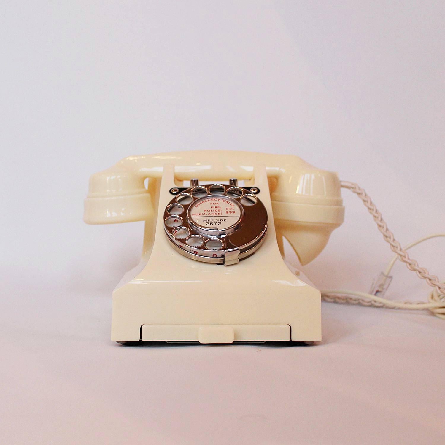 An original GPO telephone in cream Bakelite. Model number 328L. Stamped 328CB. BX58/2A to underside. With integral drawer and bell on or off switches.

 