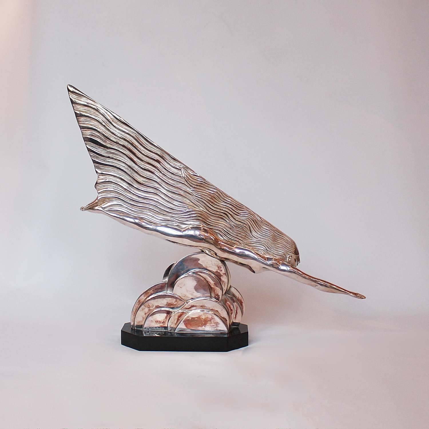 The Comet (La Cométe), an Art Deco, silvered bronze sculpture of a stylized goddess soaring through the clouds in iconically Deco streamline shape. Inspired by the concept of speed, so dominant an influence of the period.

Literature: Brian