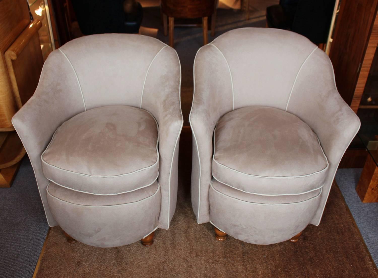 A pair of Art Deco tub chairs with shaped arms and turned wood legs. Upholstered in alcantara suede with contrast piping.

Measures: H 76cm, W 66cm, D 66cm, seat H 48cm, seat D 56cm.

 
