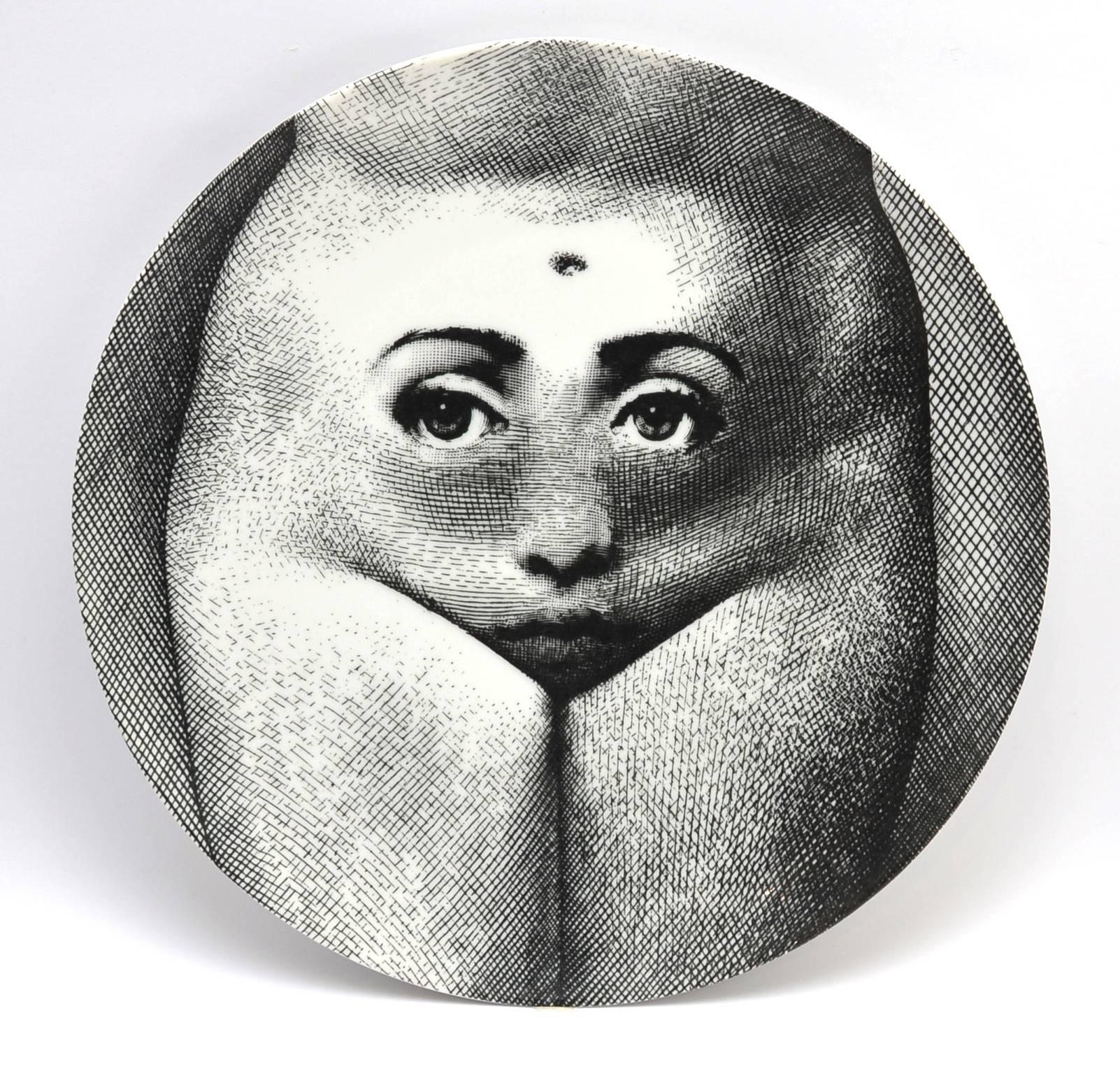 Made by Fornasetti of Milan, each marked 'Tema E Variazoni' 'Fornasetti Milano' 'Made in Italy' numbered '303' and '281' to reverse respectively, depicting the upper and lower torso of a woman respectively.