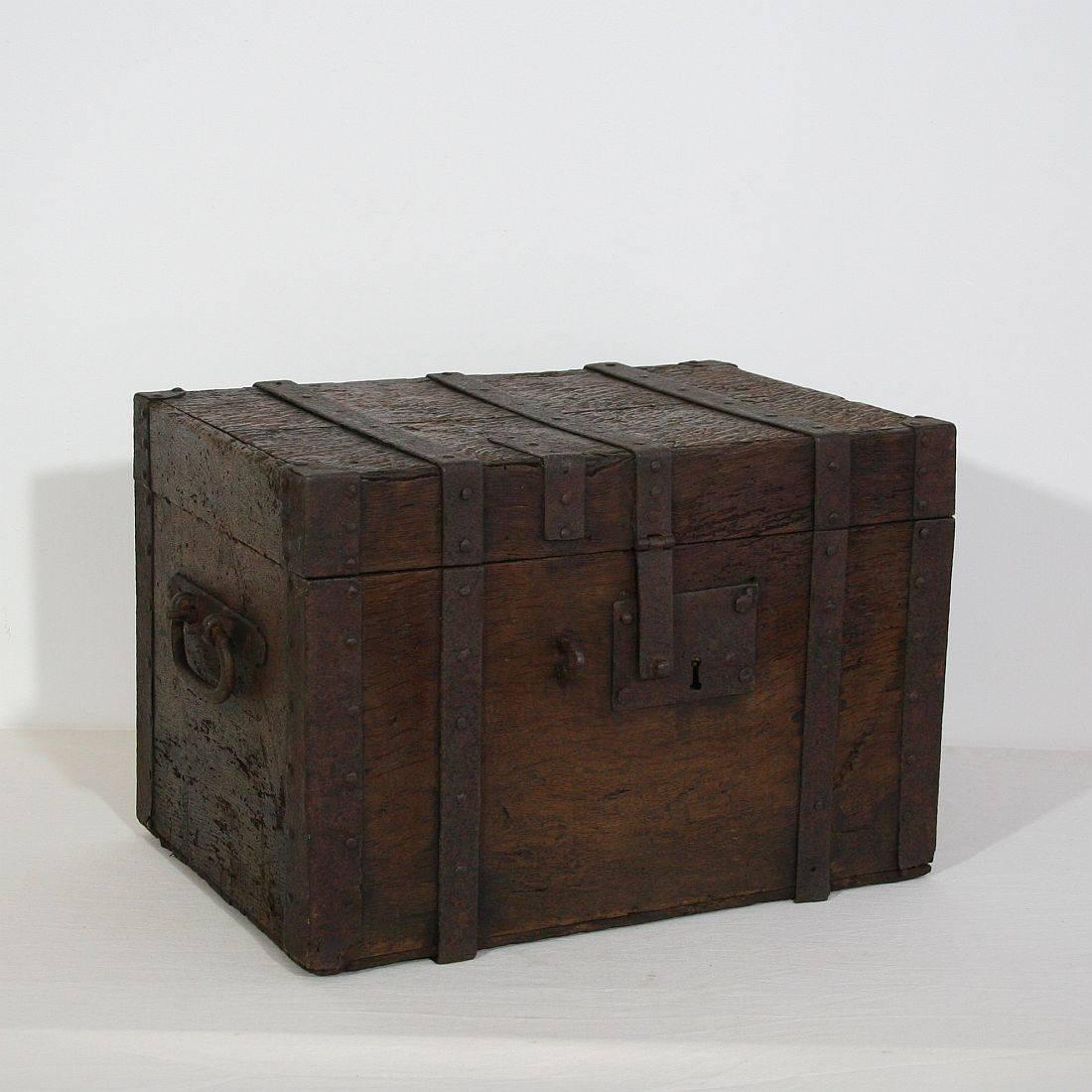 Beautiful handmade oak chest was made in France in the 17th century. It was made to hold valuables such as gold coins, jewels or maps. This was the precursor to the modern day safe. It is due to its age beautiful weathered.