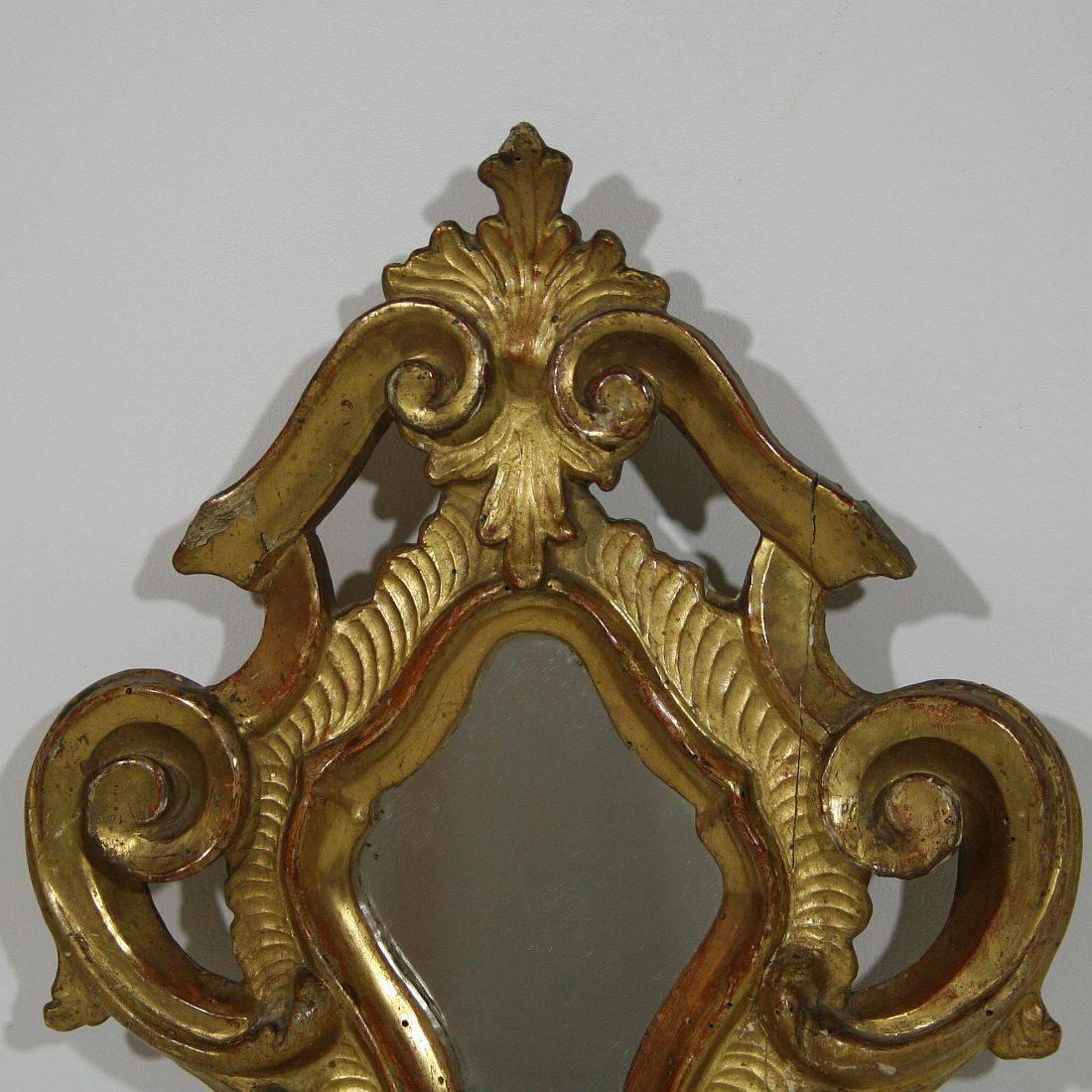 Very well carved giltwood Baroque mirror. Gorgeous small piece.
Italy, circa 1760-1800. Weathered and small repair.