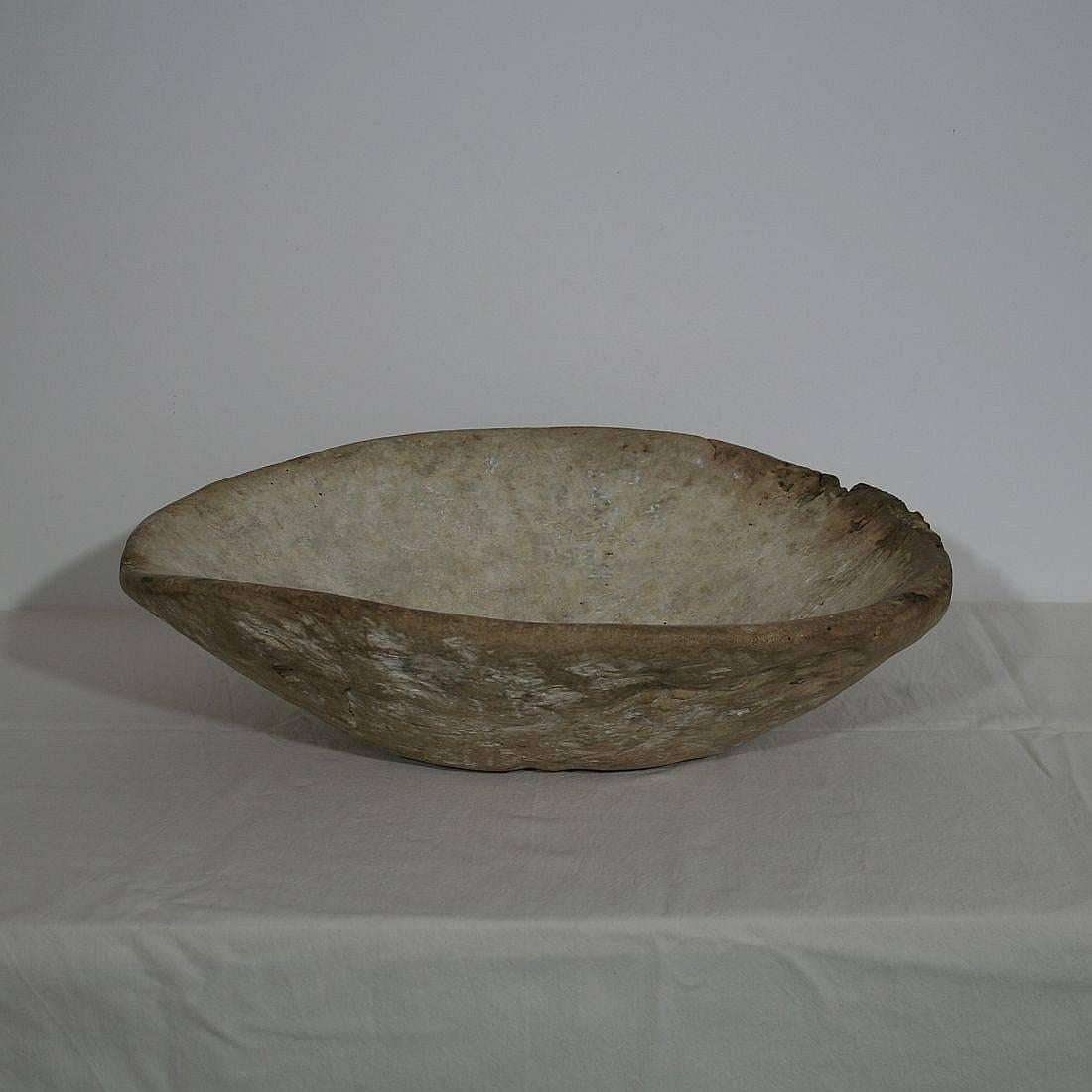 Unique and large wooden bowl with a rare collection of 19th century carved wooden petange balls. France, circa 1800-1850.
Weathered.