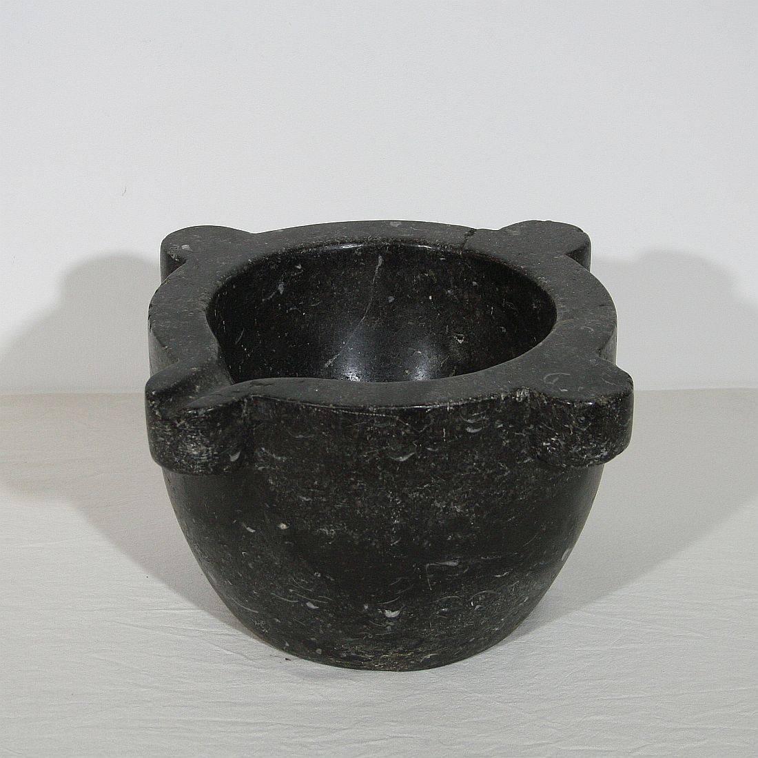 Beautiful and rare black marble mortar, France, circa 1750-1850. Great eyecatcher.
Weathered and small antique hair-line.
 