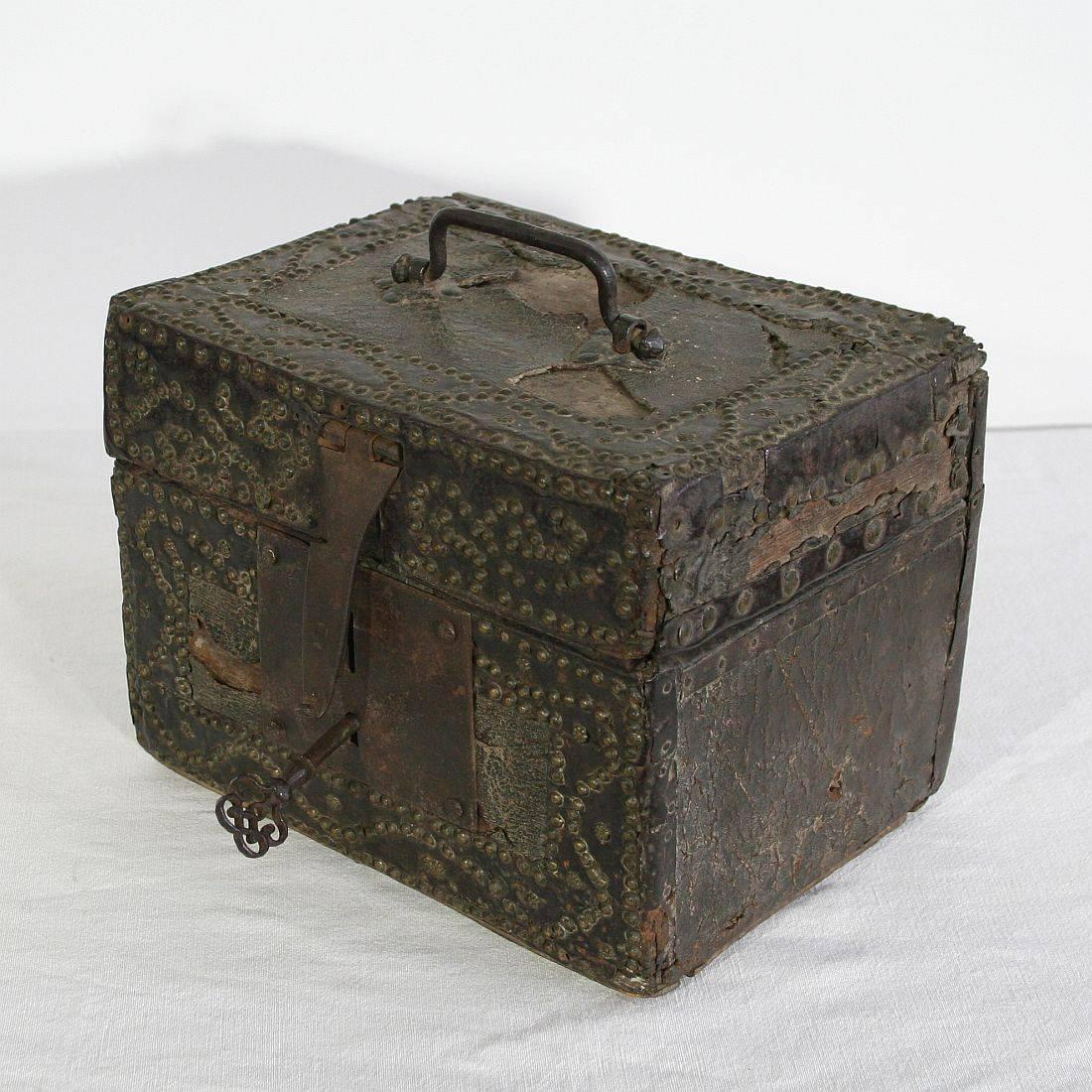 Extremely old box that is covered with leather and iron. Unique find also because the lock is still working. France, circa 1600-1700
Weathered, some losses. Key is also very old but to my opinion of a later date.
  