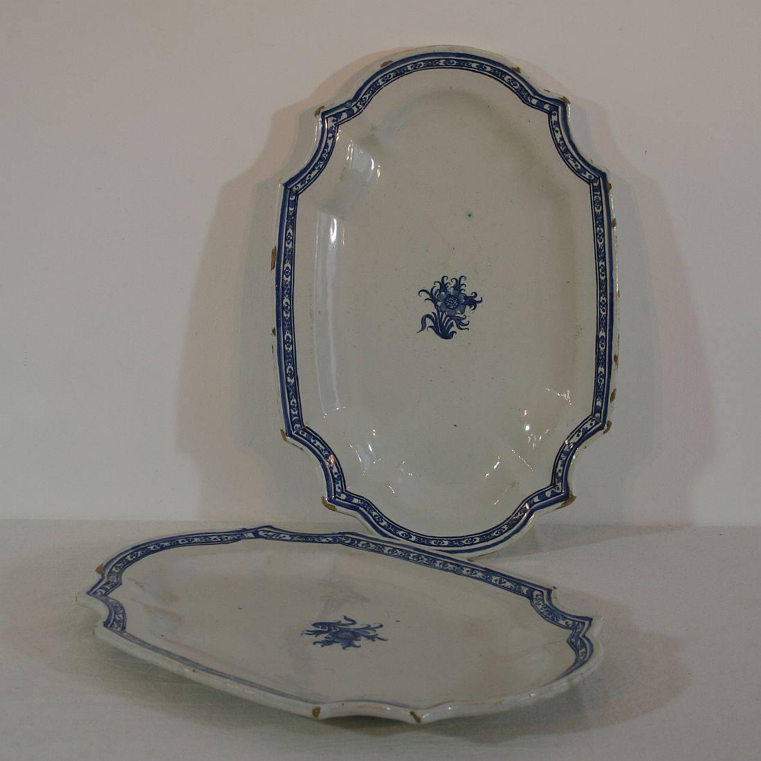 Great couple of large Rouen serving platters. Although it is a pair, they are slightly different due to the fact it was all handmade. Rouen, France, circa 1750-1800. Despite of their age in a good condition, only some chips on the edges. Measurement