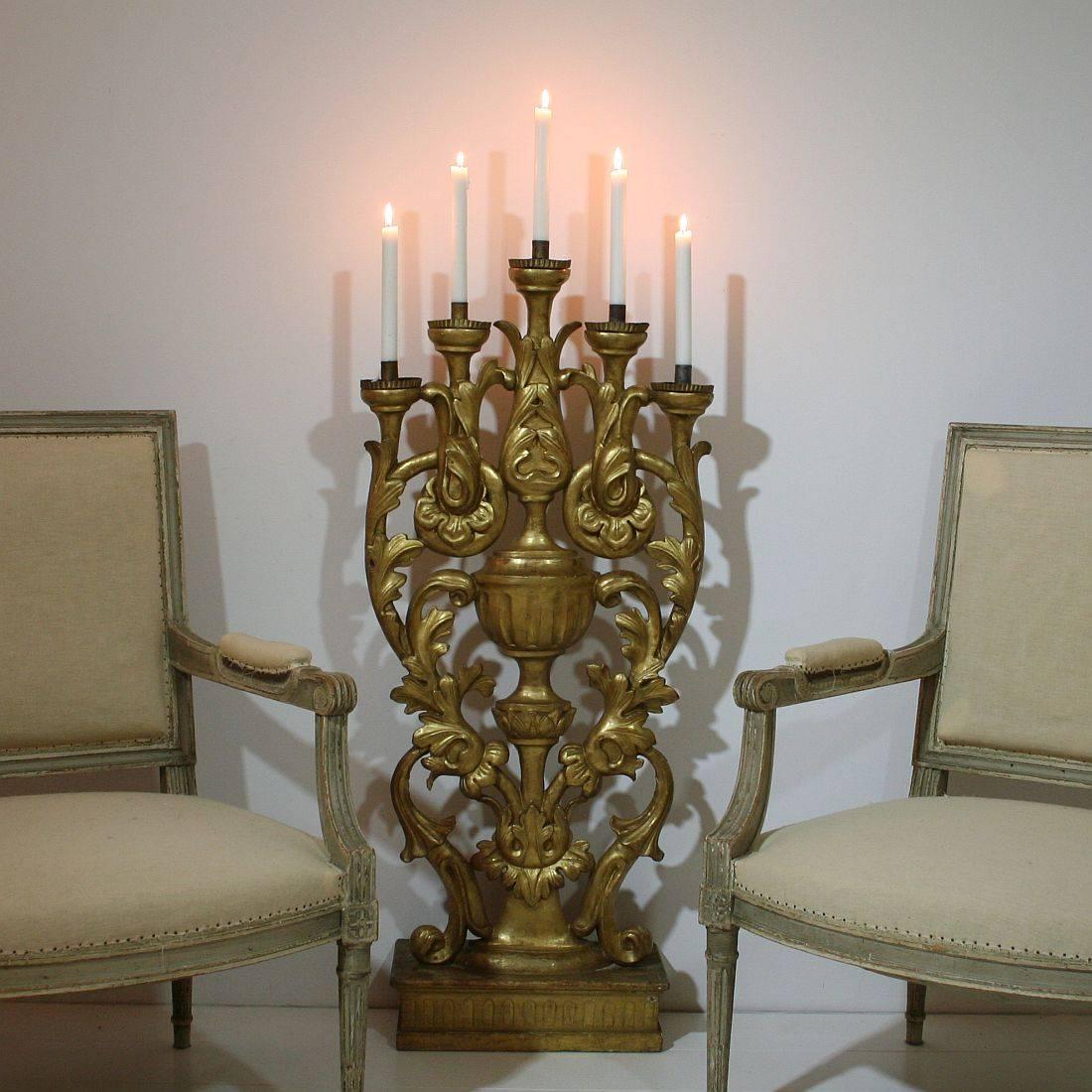 Unique Baroque style giltwood candleholder for five candles, Italy, circa 1850.
Weathered, small losses and old repairs. More pictures are available on request.