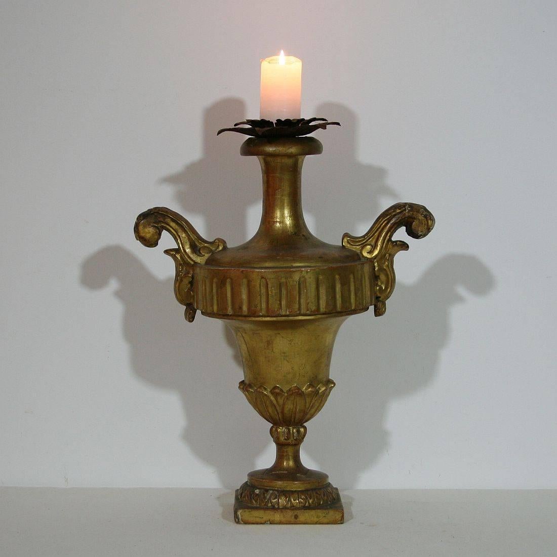 Beautiful carved and gilded wooden candlestick in the form of a vase, Italy, circa 1800-1840. Weathered, old repairs.