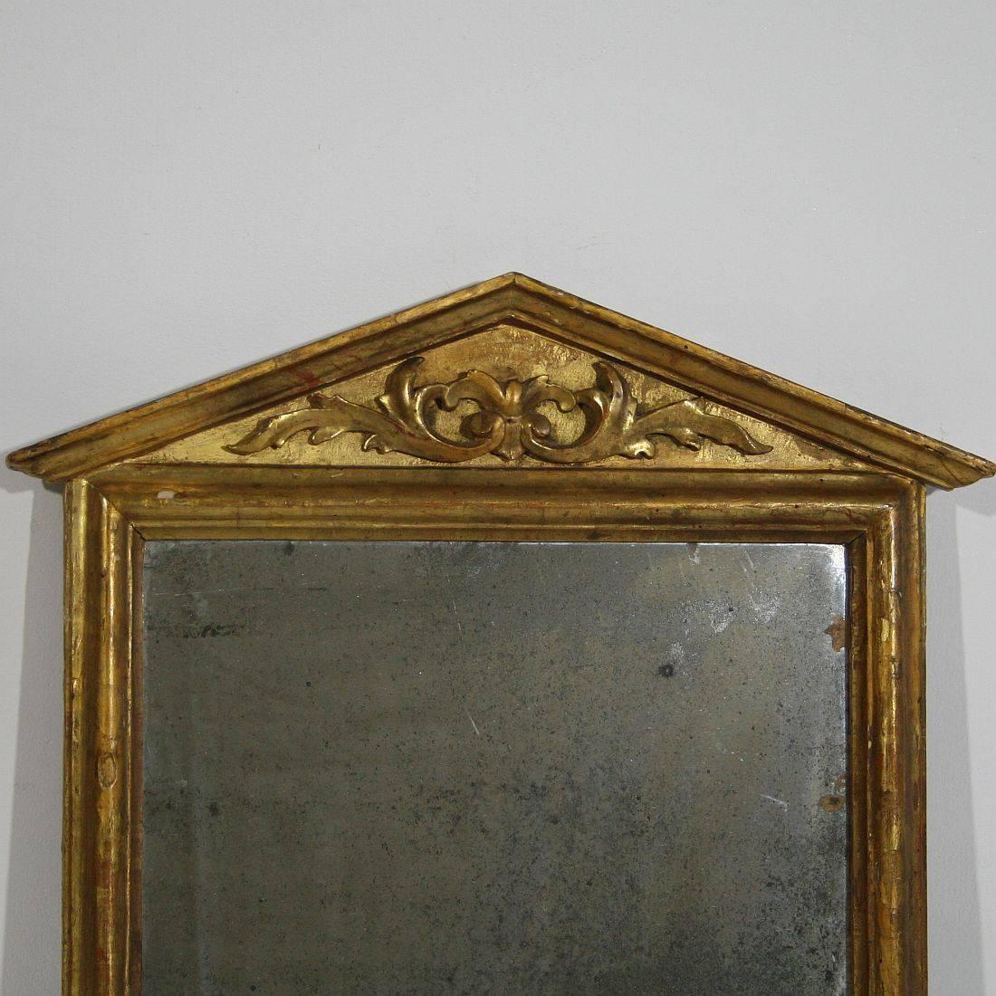 Beautiful small giltwood mirror frame with it's original weathered mirror glass, 
Italy, circa 1780-1800. Weathered.