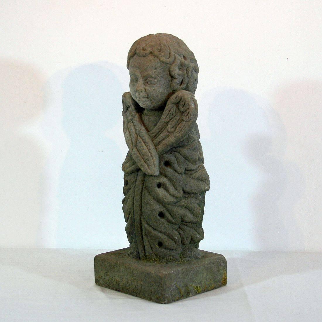 Beautiful folk-art angel with a strong expression and great patina, France, circa 1750. Weathered.