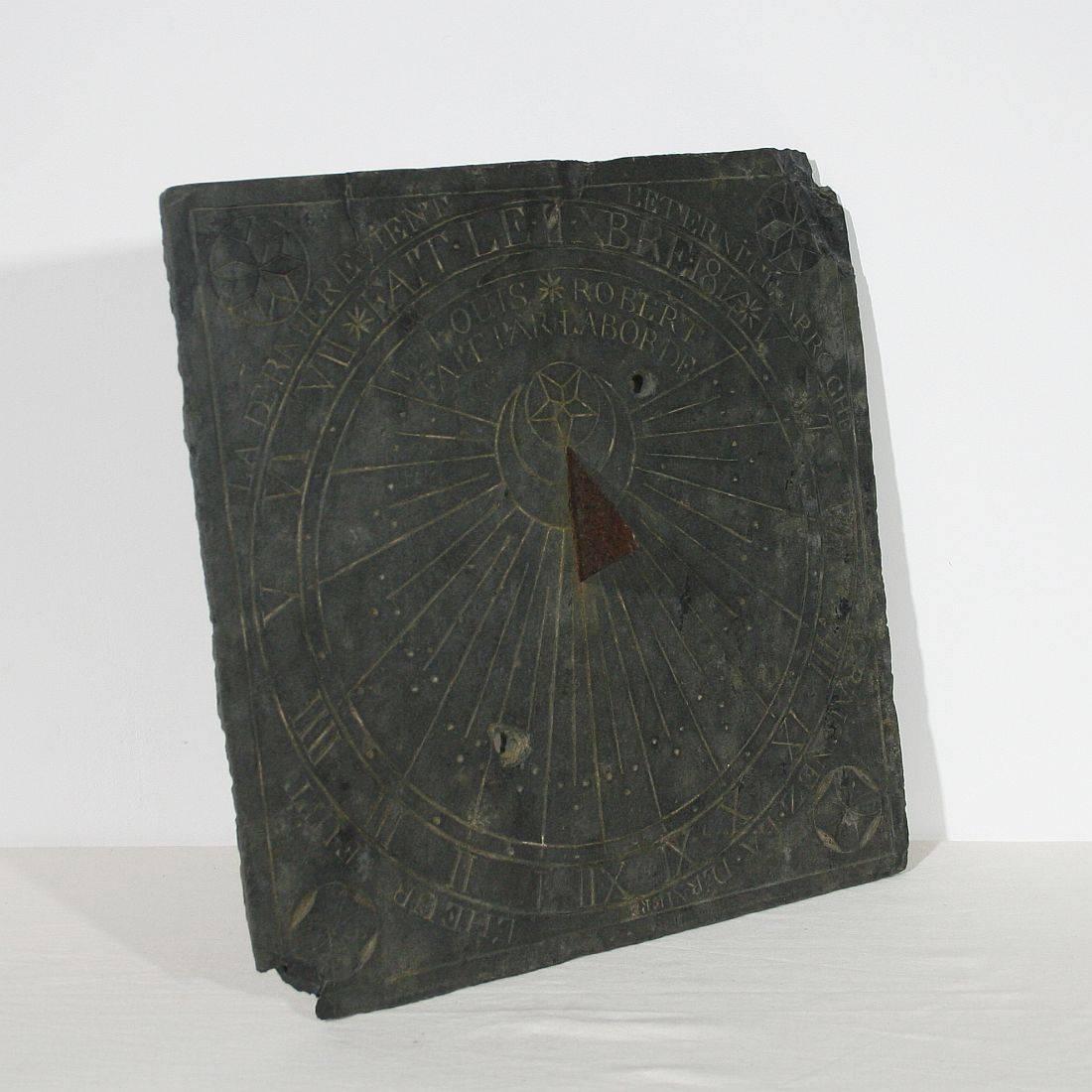 Wonderful and rare piece. Slate sundail from the year 1814. Weathered and some small losses.