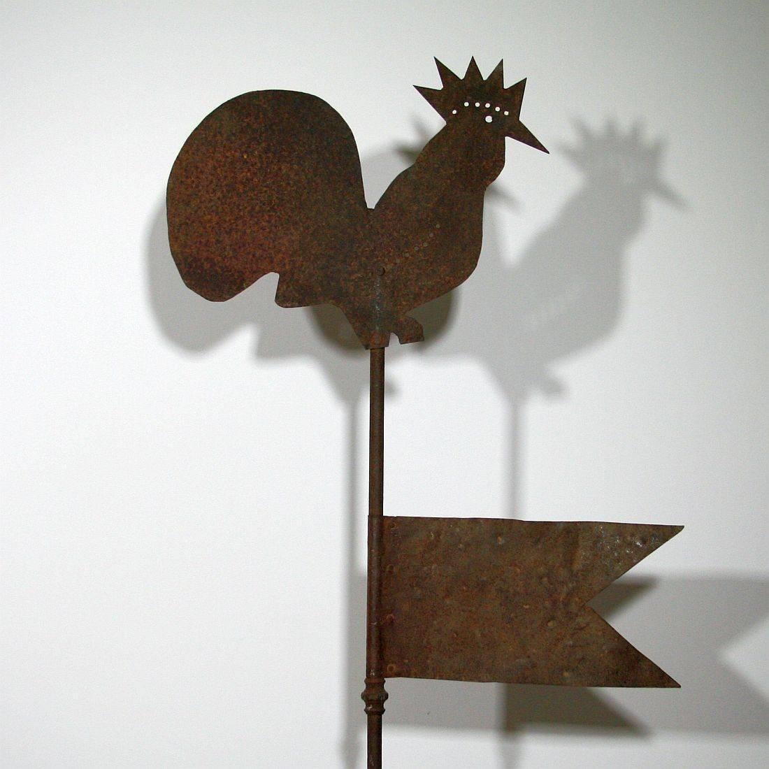 Beautiful iron weathervane with a rooster, it came from a church tower in the South of France,
circa 1750-1850
Weathered. Measurement here below is inclusive the wooden base.