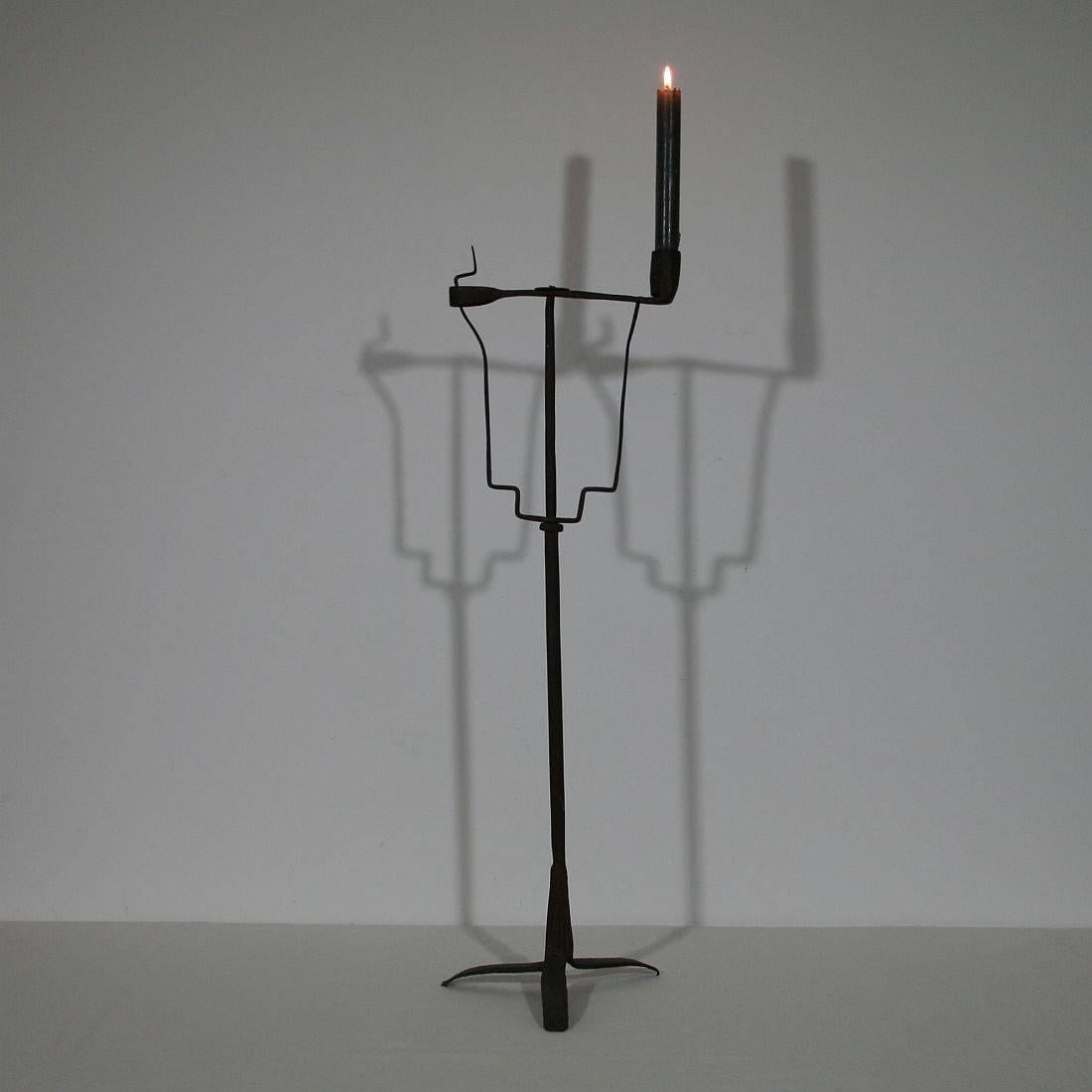 Very old and beautiful hand-forged iron candleholder
France, circa 1700-1750.