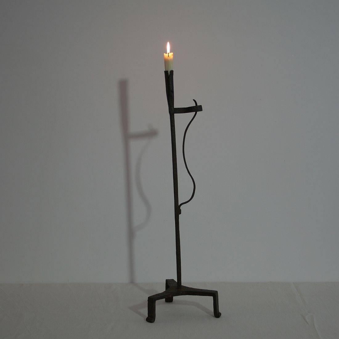 Very old and beautiful hand-forged iron candleholder
France, circa 1700-1750.