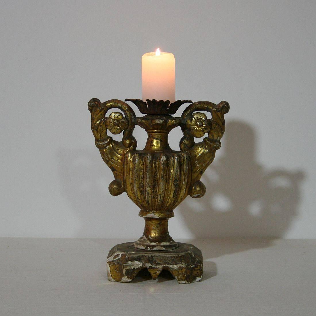Unique Baroque giltwood candleholder, Italy, circa 1750. Weathered and some small losses on the gilding.