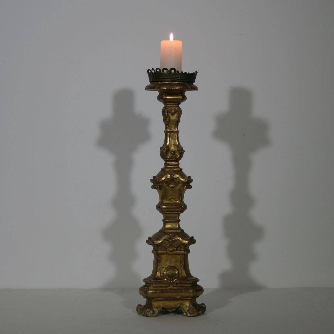 Beautiful carved and gilded wooden candlestick
Italy, circa 1750
Weathered, small losses on the gilding.