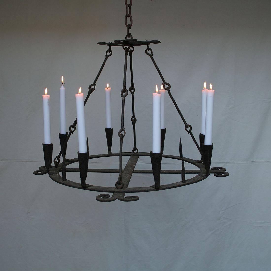 Unique and early hand-forged iron chandelier. Beautiful details and great original patina, traces of black paint, Spain, circa 1650-1750
Weathered but despite of its age in an excellent condition and ready to use.
 