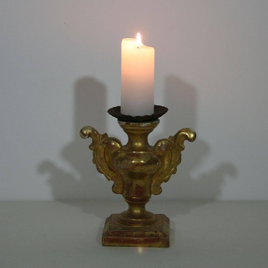 Small and unique Baroque giltwood candleholder, Italy, circa 1750. Weathered and some small losses on the gilding.