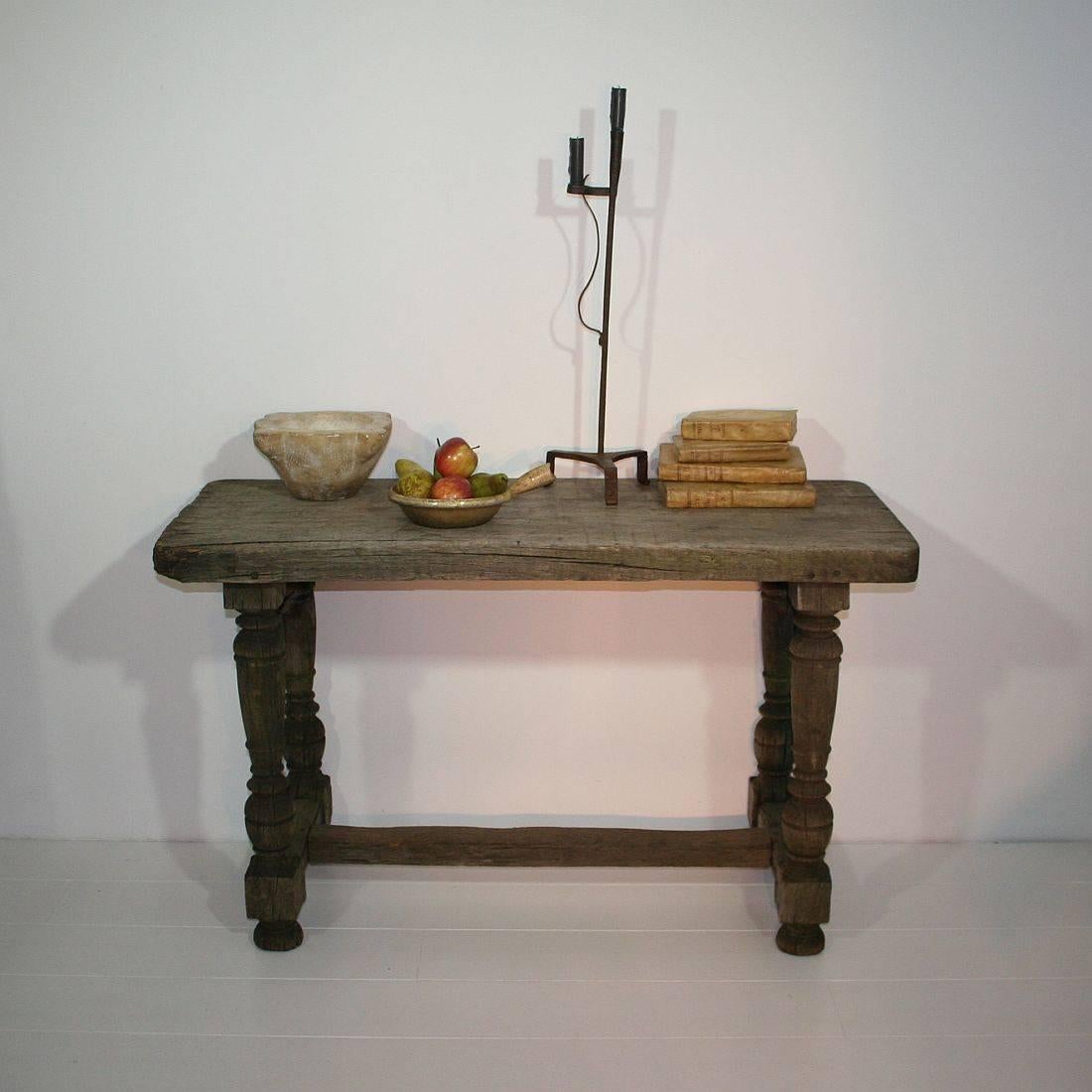 Brilliantly weathered oak table with great patina. Nice to use as a side table but also to use as a very small dining table, France, circa 1750-1850
Weathered condition and some small losses. More pictures are available on request.