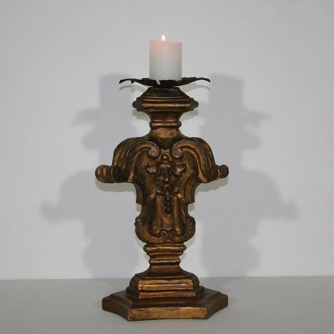 Carved wooden Baroque candleholder,
Italy, circa 1750. Weathered, small losses.