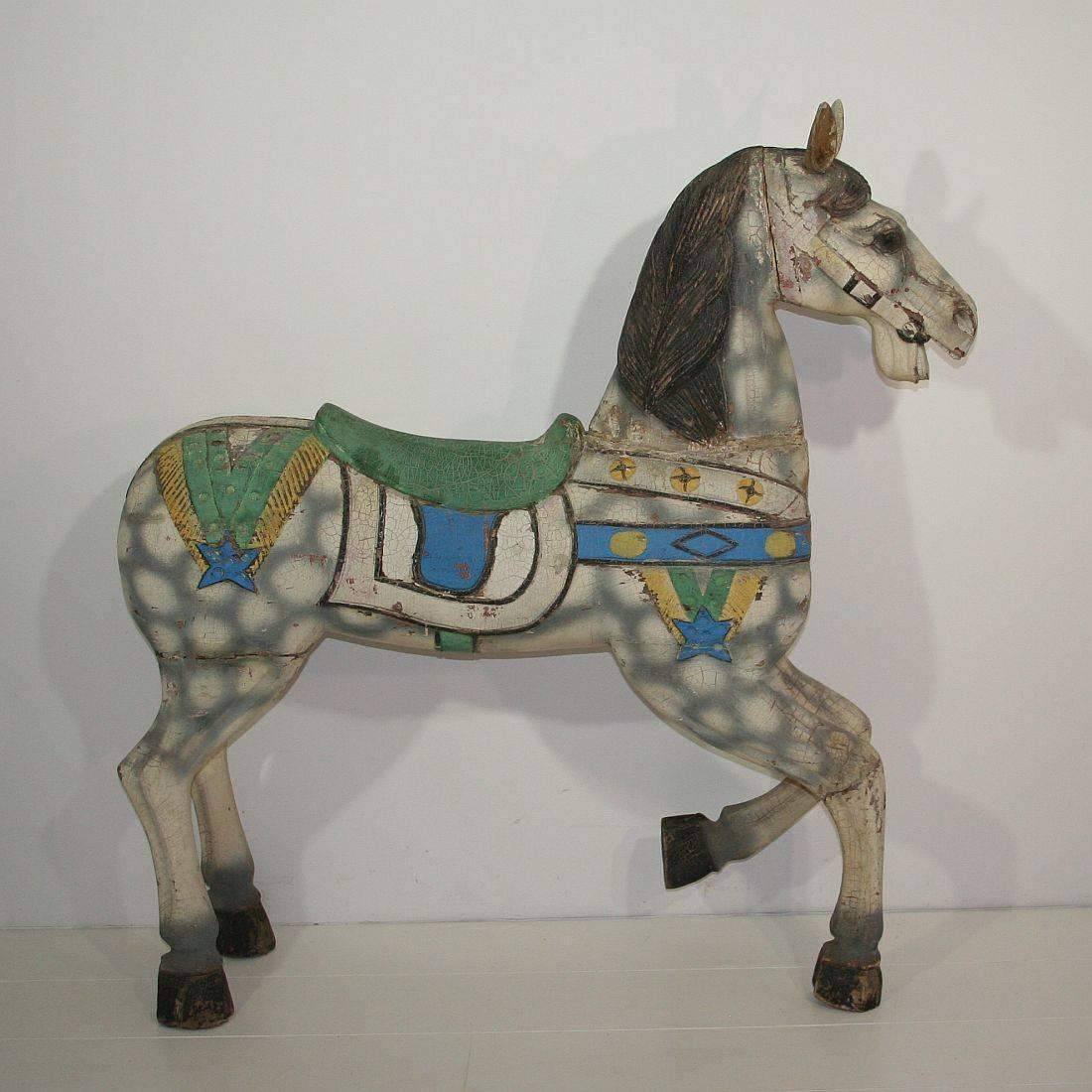 Beautiful and very large carousel horse with its fabulous paint-color.
England, circa 1900-1930. Weathered, small losses and old repairs. More pictures available on request.


