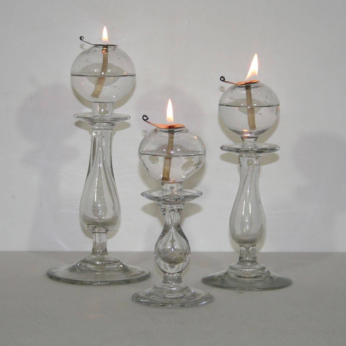 Rare collection of three handblown glass weaver oil lamps from the south of France, France, circa 1800-1900
Very good condition. More pictures available on request.
Measures: H 18-26cm (7-10,25 in) W 8-11.5 cm (3-4.5 in) D 8-11.5 cm (3-4.5 in)