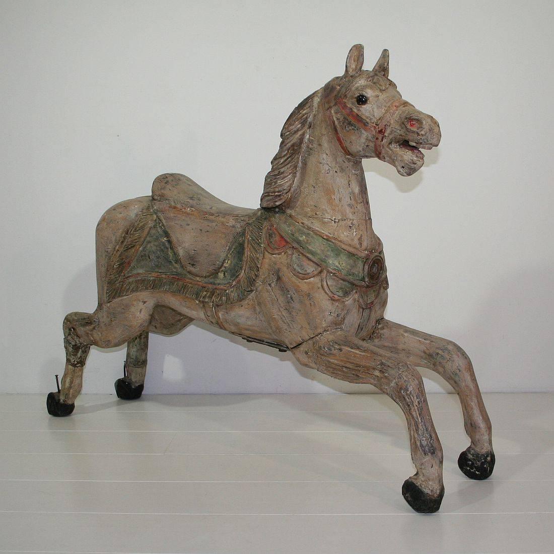 Beautiful carousel horse with traces of its original paint and the stunning patina. Probably from the school of Gustav Bayol. Gustav Bayol is the most famed French carousel carver.
Paris, France, circa 1880-1900.
Weathered, small losses and great