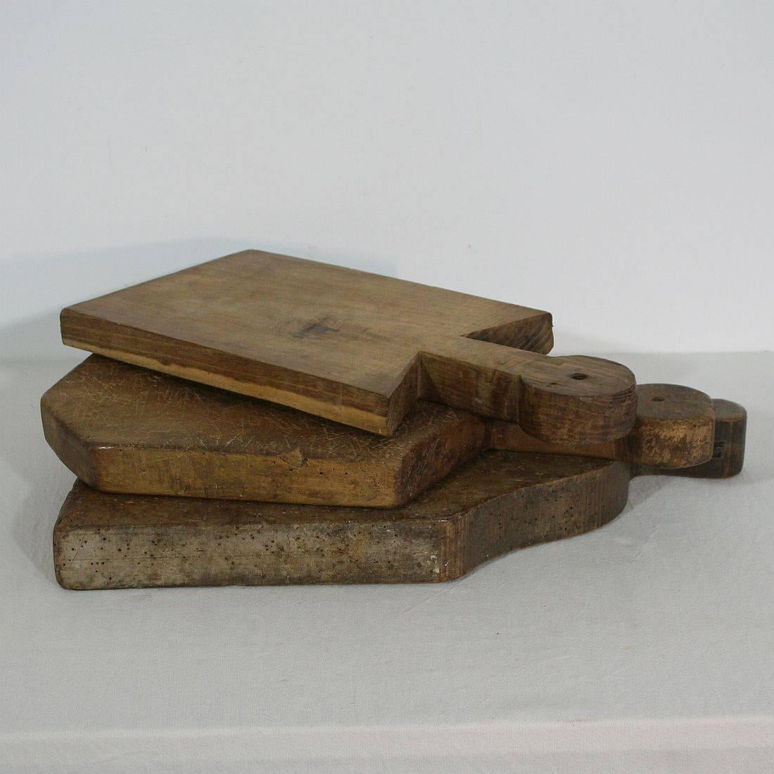 Beautiful small collection of three wooden chopping-cutting boards. Great statement on your counter-top
France, circa 1850-1900. Weathered.
Measures: H 41.5-49cm (16,25-19,25in) W 20.5-39cm (8-15,25in) D 3-5cm (1,25-2in) each, together: D