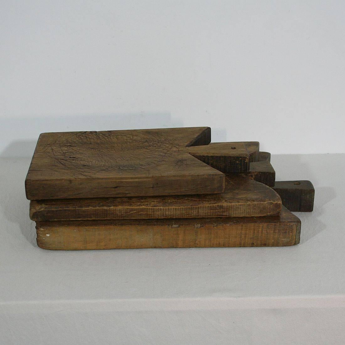Beautiful small collection of three wooden chopping-cutting boards. Great statement on your counter-top
France, circa 1850-1900. Weathered.
Measure: H 38-48.5cm (15-19in), W 23.5-32cm (9-12.5in), D 3.5-4.5cm (1.25-1.75in) each, together: D 12cm(