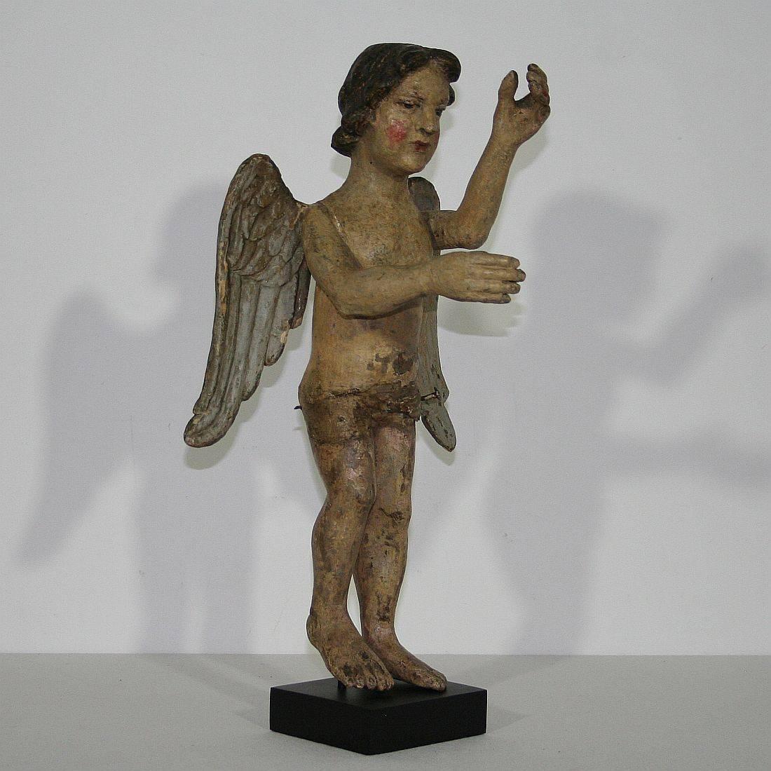 Very nice Folk Art standing angel with its original color and great expression
France, circa 1750
Weathered, small losses and old repairs
Measurement is with the wooden base.
More pictures are available on request.