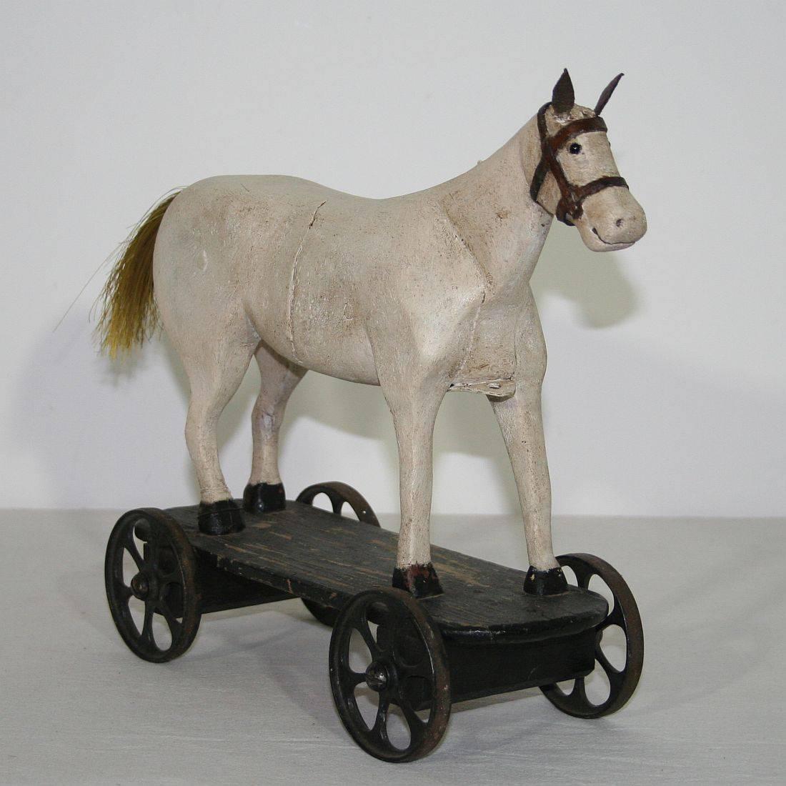 Great example of a Folk Art horse. 
Once a toy for a better situated child now a great piece in your interior.
Beautiful details and glass eyes
France, circa 1850
Weathered and small old repairs.
More pictures are available on request.