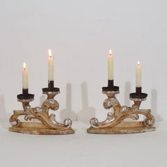 Couple of 18th Century Italian Baroque Carved Wooden And Silvered Candleholders