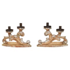 Couple of 18th Century Italian Baroque Carved Wooden And Silvered Candleholders