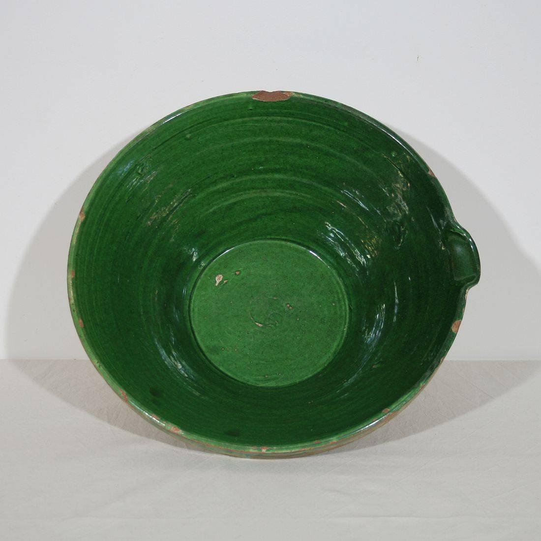 Fabulous antique French tian (bowl) handmade from terracotta with a distinctive deep green glaze. Perfect for as a fruit bowl, as the perfect centerpiece with a bouquet of flowers, or alone as an awesome Country French accent. Tian is a word which