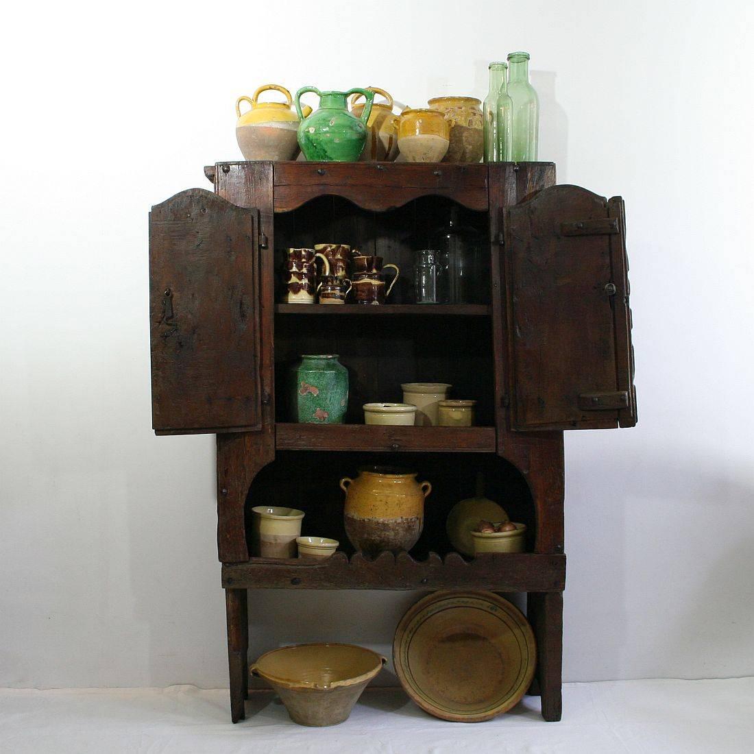 Extremely rare and beautiful Spanish oak cupboard. Bottle storage and cabinet. Beautiful patina and it's wrought iron hinges and nails. Despite of its age in a relative good condition. Old repairs, backside renewed, circa 1970. More pictures