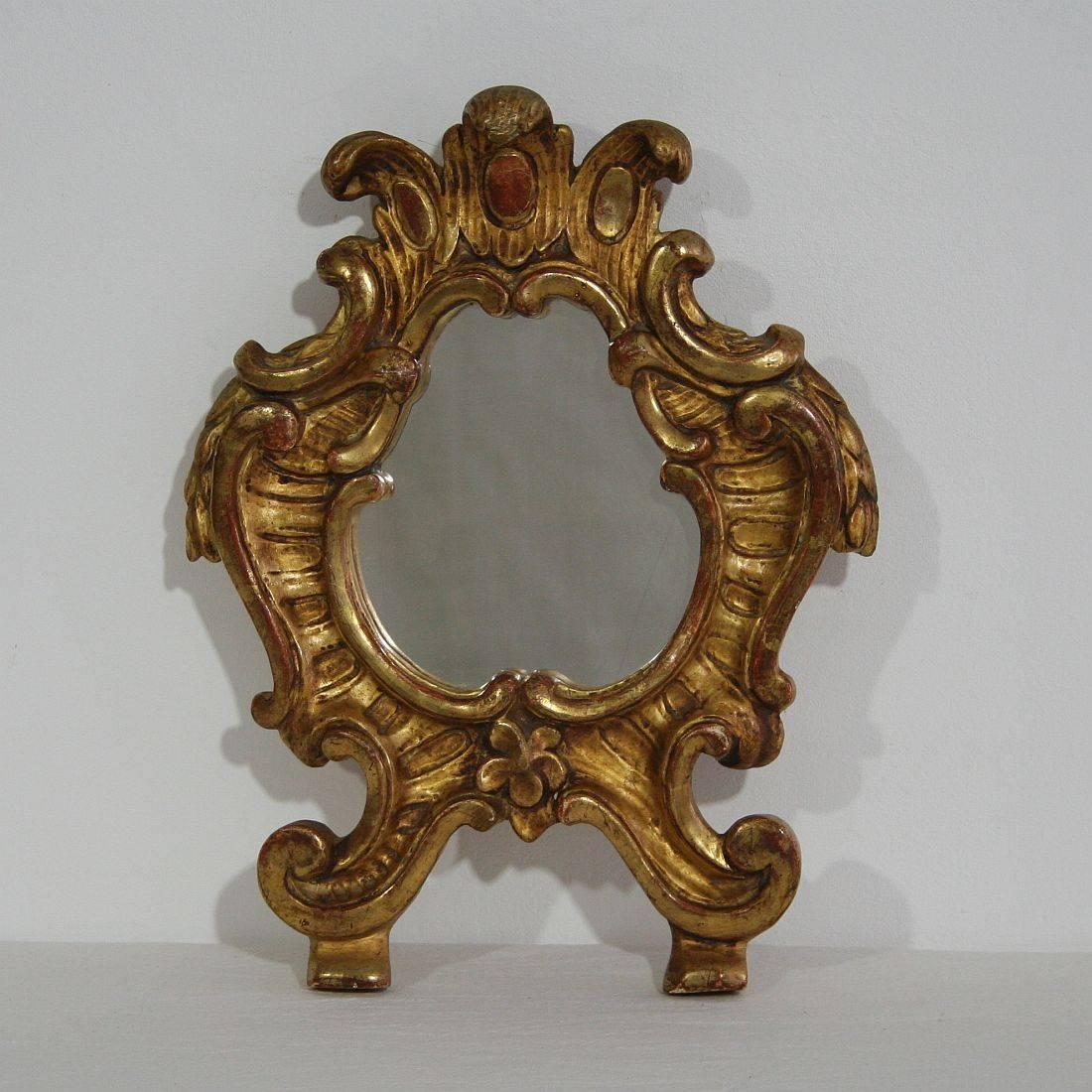 Very well carved giltwood Baroque mirror. Gorgeous small piece.
Italy, circa 1850-1900. Mirror glass of later date.
 