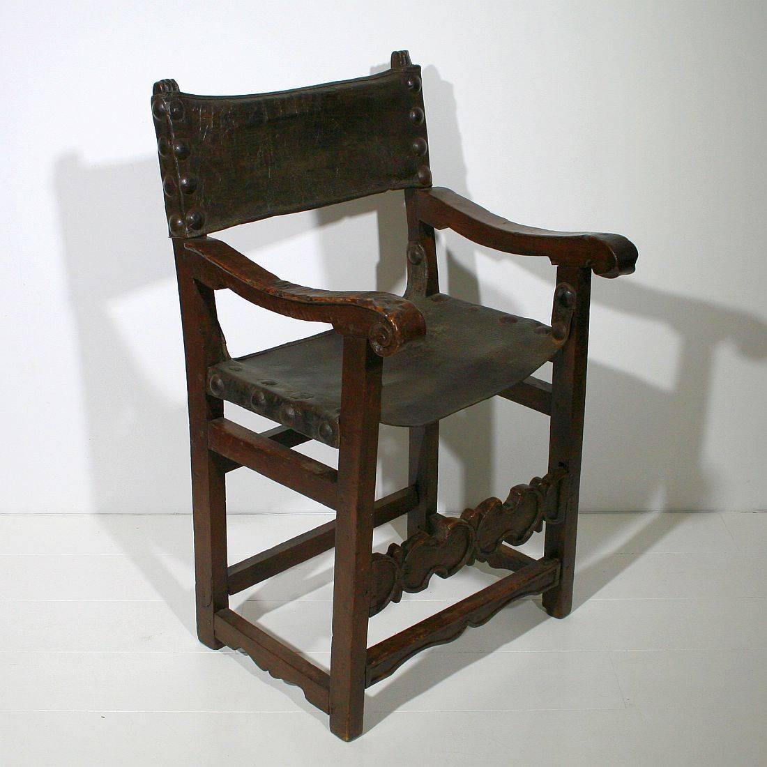 Spectacular Renaissance chair with original leather seating and back. Unique piece in relative good condition, France, circa 1600-1650
Weathered, small losses and old repairs.