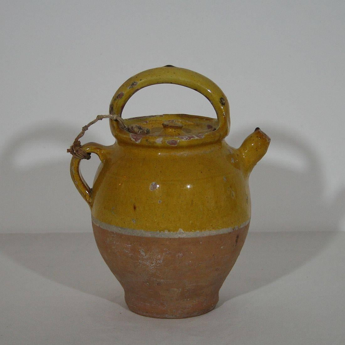 Great authentic and rare piece of pottery from the Provence. Beautiful weathered and an amazing colour . Imperfections help authenticate this water cruche as it was an utilitarian type piece, France, circa 1850.

 