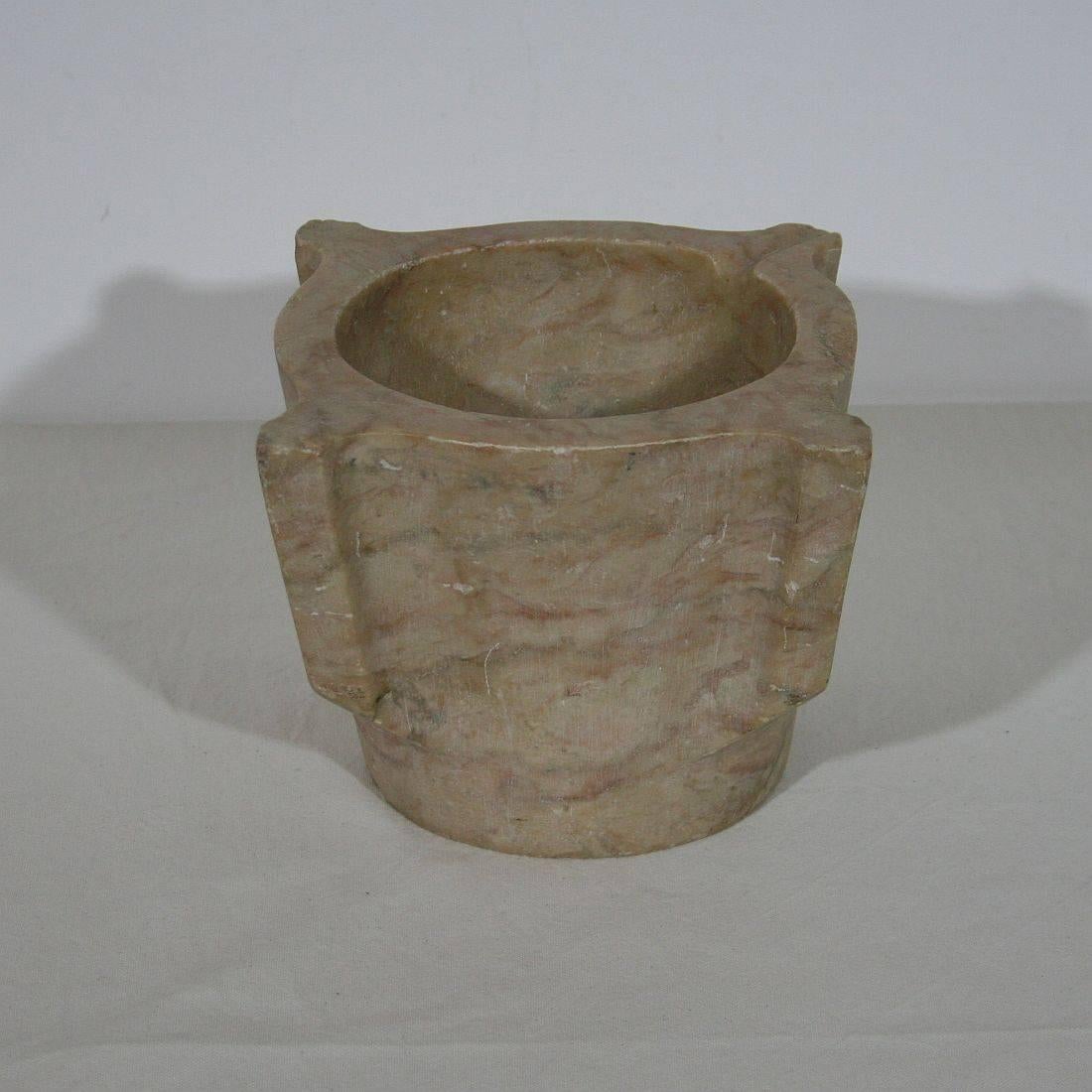 Great marble mortar with a form not seen every day and a beautiful color, France, circa 1800. Weathered.