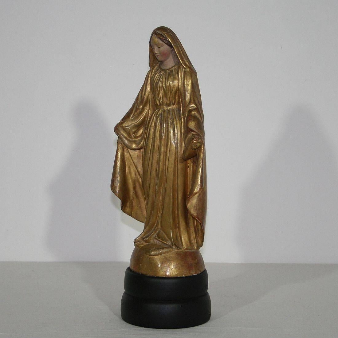 Beautiful Madonna with her original gilding, France, circa 1800-1850
Weathered and some losses (missing the hands). Measurement here below inclusive the wooden base.